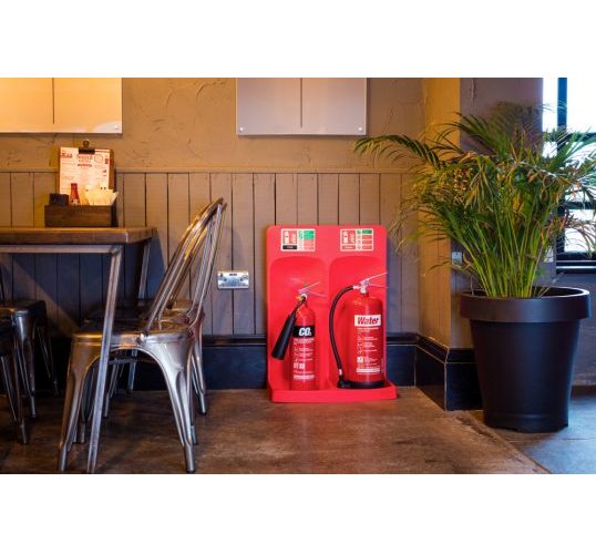 Double CO2 and water fire extinguisher stand in red